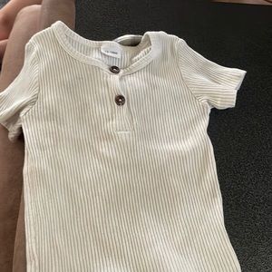 White shirt , matches with white shorts